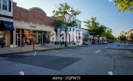 GREENWICH, CT, USA - SEPTEMBER 11, 2021:  Storefronts with morning lights at Greenwich Avenue Stock Photo