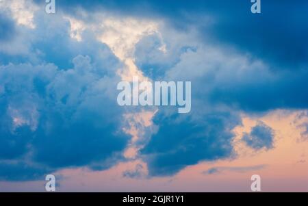 Sunset cloudscape with blue stratocumulus castellanus clouds. Rangeley, ME, US. Stock Photo