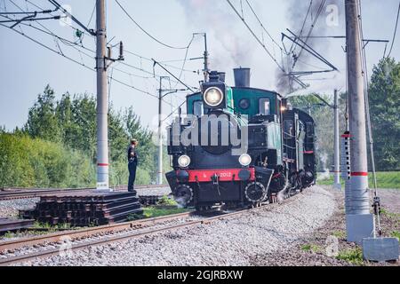 Moscow, Russia - August 27, 2021: Steam retro train stands by the station. Stock Photo