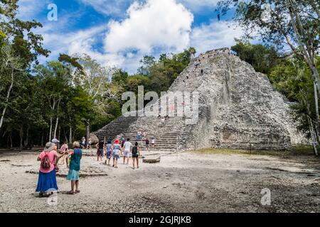 COBA, MEXICO - MARCH 1, 2016: Tourist visit the Pyramid Nohoch Mul at the ruins of the Mayan city Coba, Mexico Stock Photo