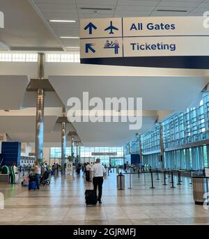 Myrtle Beach, SC USA - September 3, 2021: Interior view of the Myrtle Beach International Airport with flight attendants and customers passing by Stock Photo