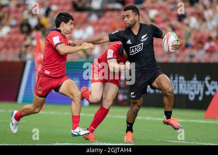 SINGAPORE-APRIL 13:New Zealand 7s Team (blalck) plays against Spain 7s team (red) during Day 1 of HSBC World Rugby Singapore Sevens on April 13, 2019 at National Stadium in Singapore Stock Photo