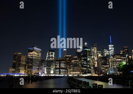 Brooklyn, New York, USA. 11th Sep, 2021. An overall view of The Towers of Light Memorial illuminating the New York City skyline with The Freedom Tower on The 20th anniversary of The 9/11 attacks as seen from The Brooklyn Heights Promenade in Brooklyn, New York. Mandatory credit: Kostas Lymperopoulos/CSM/Alamy Live News Stock Photo