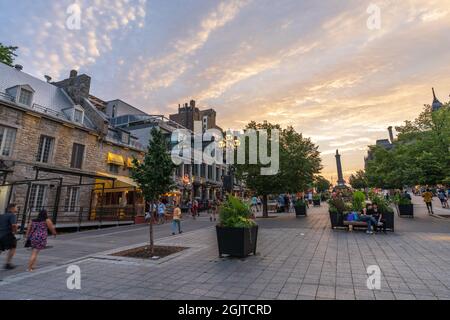 Montreal, Quebec, Canada - August 25 2021 : Old Montreal district street view at dusk. A steady stream of tourists come to visit here during covid-19 Stock Photo