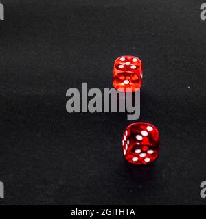 red transparent dice on black background Stock Photo