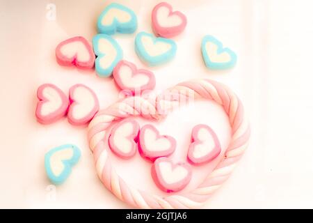 colorful candies marshmellow heart shape love sign background, top view, copy space Stock Photo