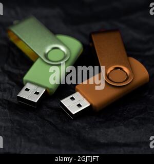 colored usb drives on black background Stock Photo