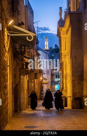 Eastern Orthodox Nuns Walk Along Via Dolorosa Street Believed To Be The