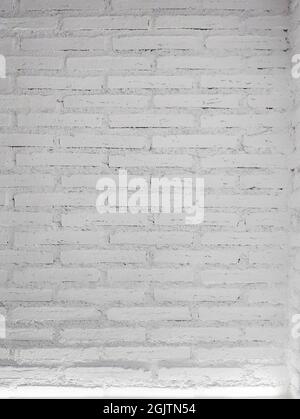 White brick wall background with a light. vertical size. Stock Photo