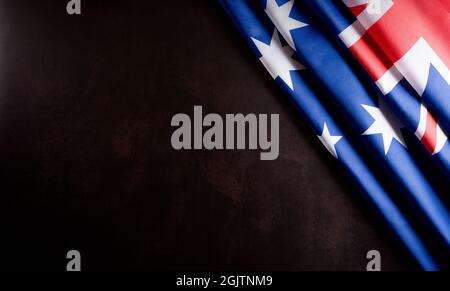 Australia day concept. Australian flag against dark stone background. 26 January. Stock Photo