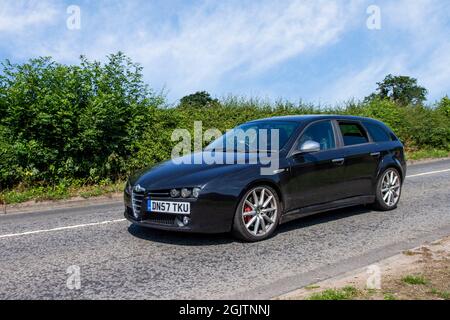 2007 black Alfa Romeo 159 JTDM TI Qtronic 2387 cc 4dr saloon en-route, 20v turbodiesel 5-cyl, 210bhp car enroute to Capesthorne Hall classic July car show, Cheshire, UK Stock Photo