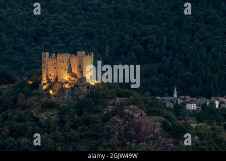 The ancient castle of Ussel, Chatillon, Italy, illuminated by artificial lights in the evening Stock Photo