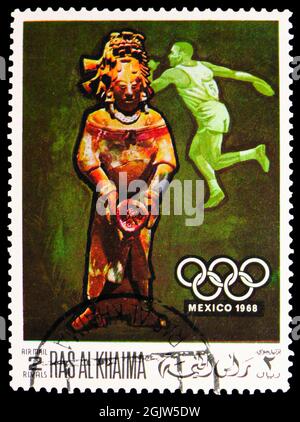 MOSCOW, RUSSIA - JUNE 20, 2021: Postage stamp printed in Ras al Khaimah shows Discus throwing, pre-columbian sculpture, Summer Olympics 1968, Mexico s Stock Photo