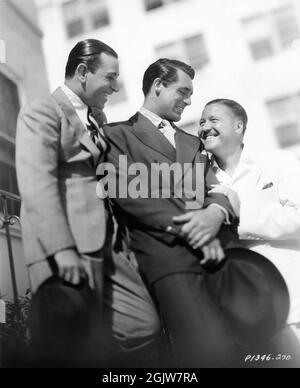 GEORGE RAFT CARY GRANT and JACK OAKIE candid on the Paramount Studios Lot in Hollywood in 1935 publicity for Paramount Pictures Stock Photo