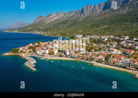 Aerial view of Gradac town below Biokovo mountain, the Adriatic Sea, Croatia Stock Photo