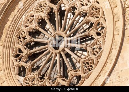 Close-up of the rose window mabe by Leccese sandstone, above the entrance of the Cathedral of Otranto, province of Lecce, Salento, Puglia, Italy Stock Photo