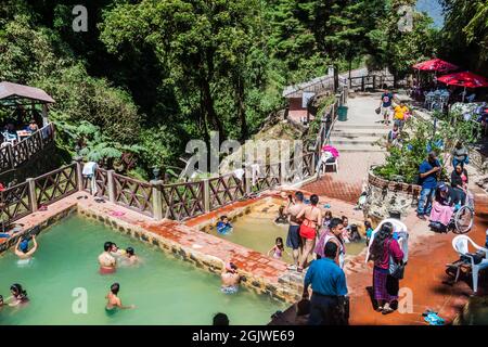 FUENTES GEORGINAS, GUATEMALA - MARCH 22, 2016: People bathing in a thermal pool Funtes Georginas. Stock Photo