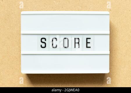 Lightbox with word score on wood background Stock Photo