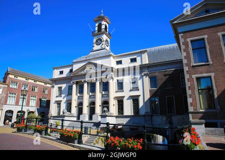 Dordrecht (Stadhuis), Netherlands - July 9. 2021: View on town hall with red flowers against blue summer sky Stock Photo