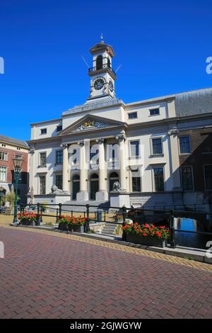 Dordrecht (Stadhuis), Netherlands - July 9. 2021: View on town hall with red flowers against blue summer sky Stock Photo