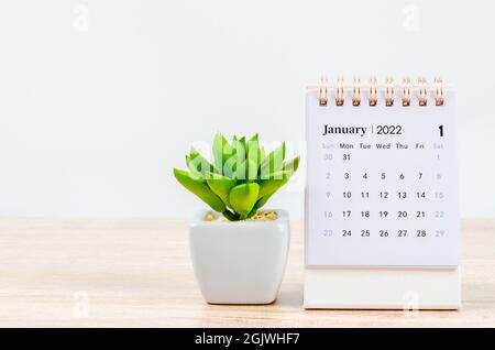 January 2022 desk calendar on wooden table. Stock Photo