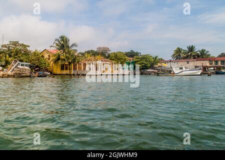 Boats and houses in Livingston village, Guatemala Stock Photo