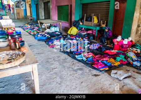 SAN MATEO IXTATAN, GUATEMALA, MARCH 19, 2016: Clothes stall on a market in San Mateo Ixtatan village. Stock Photo