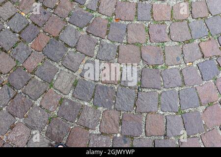 Old cobblestone pavement close-up background and texture Stock Photo