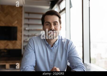 Portrait of young Caucasian man have webcam call Stock Photo