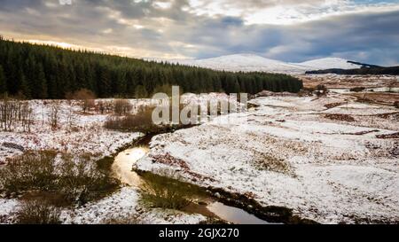 Sunset over a snow covered Big Water of Fleet valley at the railway viaduct, Dumfries and Galloway, Scotland Stock Photo