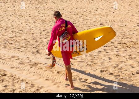 Bournemouth, Dorset UK. 12th September 2021. UK weather: warm and sunny at Bournemouth beaches as beachgoers head to the seaside to enjoy the sunshine. RNLI Lifeguard. Credit: Carolyn Jenkins/Alamy Live News Stock Photo