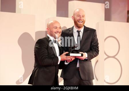 Venice, Italy. 11th Sep, 2021. Lucas Engel (R) pose with Orizzonti Award for the Best Short Film for 'Los Huesos' at the awards winner photocaller 11, 2021 in Venice, Italy. Credit: Annalisa Flori/Media Punch/Alamy Live News Stock Photo