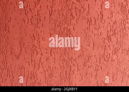 Red rough cement plaster wall Stock Photo