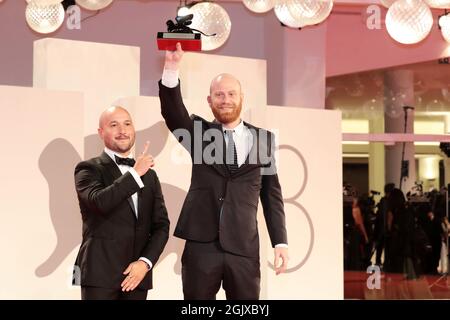 Venice, Italy. 11th Sep, 2021. Lucas Engel (R) pose with Orizzonti Award for the Best Short Film for 'Los Huesos' at the awards winner photocaller 11, 2021 in Venice, Italy. Credit: Annalisa Flori/Media Punch/Alamy Live News Stock Photo