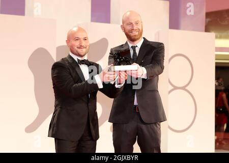 Venice, Italy. 11th Sep, 2021. Lucas Engel (R) pose with Orizzonti Award for the Best Short Film for 'Los Huesos' at the awards winner photocaller 11, 2021 in Venice, Italy. Credit: Annalisa Flori/Media Punch/Alamy Live News Stock Photo