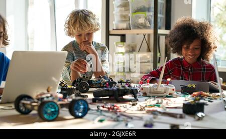Group of diverse schoolkids on STEM science engineering educational class. Stock Photo