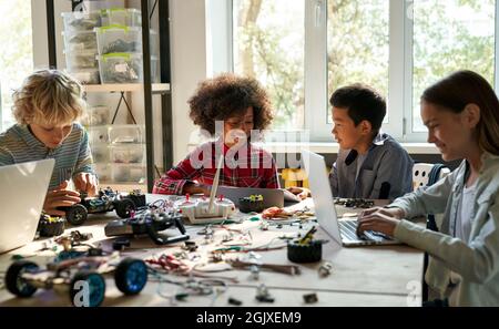 Classroom for group of multiracial schoolkids on science engineer education. Stock Photo