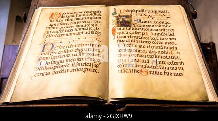 TURIN, ITALY - CIRCA MAY 2021: antique Medieval manuscript with ancient calligraphy. Stock Photo