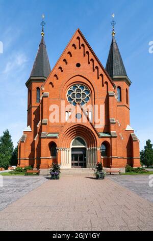 Red brick building of the Sankt Petri Kyrka, or Saint Peter Church, in Vastervik, Sweden, on a sunny summer day. Stock Photo