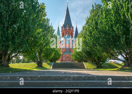 Red brick building of the Sankt Petri Kyrka, or Saint Peter Church, in Vastervik, Sweden, on a sunny summer day. Stock Photo