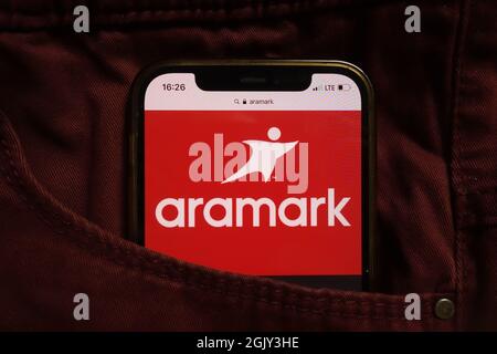 KONSKIE, POLAND - September 04, 2021: Aramark Corporation logo displayed on mobile phone hidden in jeans pocket Stock Photo