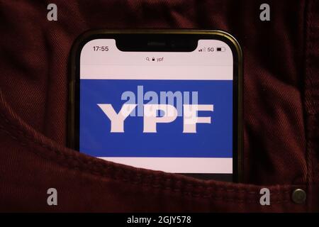 KONSKIE, POLAND - September 04, 2021: YPF company logo displayed on mobile phone hidden in jeans pocket Stock Photo