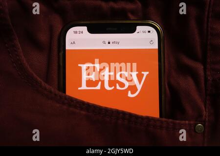 KONSKIE, POLAND - September 04, 2021: Etsy Inc logo displayed on mobile phone hidden in jeans pocket Stock Photo