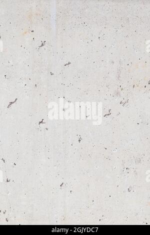 Close-up of a cement or concrete wall with small holes, front view. High resolution full frame textured background. Copy space. Stock Photo