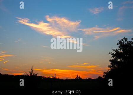 Viewing a colorful sunset from Chestnut Point of Manasquan Reservoir, Howell, New Jersey, USA Stock Photo