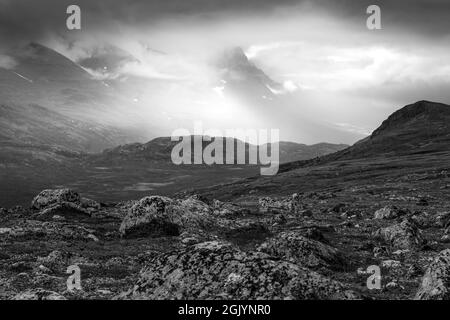 Extremely bad weather with low clouds and rain in remote, harsh arctic landscape. Rapadalen valley in Sarek National Park, Swedish arctic. Stock Photo