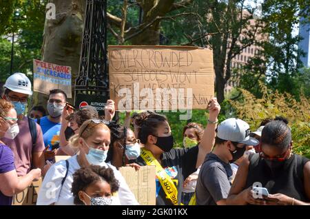 Concerned NYC municipal employees and school students gathered at City Hall Park to demand the restoration of remote work & school for all students. Stock Photo