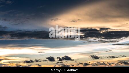 Background of colorful dramatic cloudy sky before the sunset Stock Photo