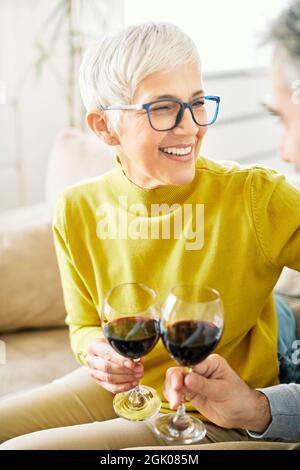 senior woman drinking wine toast happy love glass Stock Photo