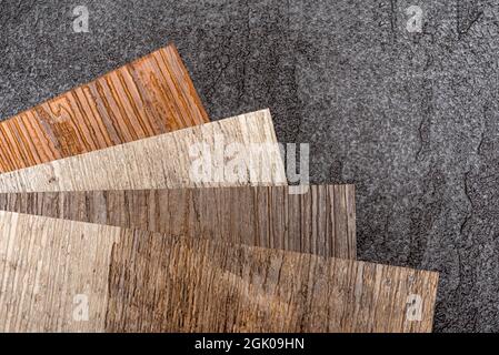 PVC vinyl floor. Samples of vinyl flooring. Collection of vinyl tiles. DIY home items Stock Photo